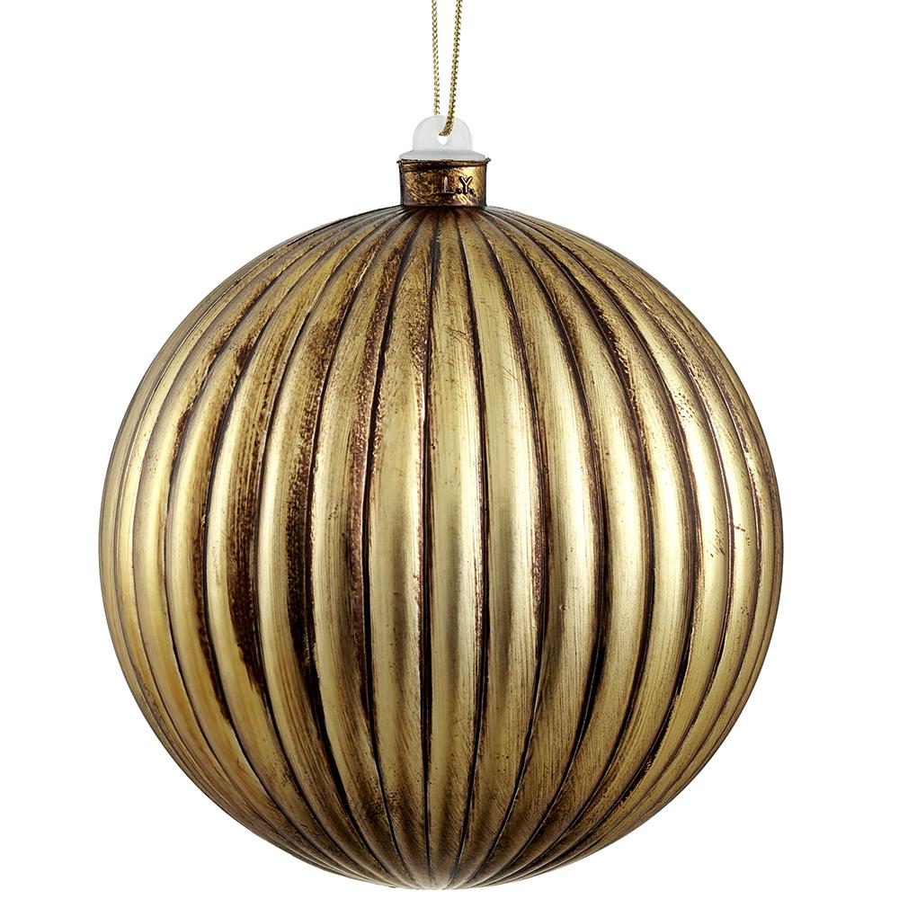6-inch antique gold plastic ball ornament with vertical ribbed texture and a weathered finish.