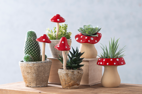 Multi-colored mushroom-shaped planter with dimensions 4-3/8 inches wide and deep.