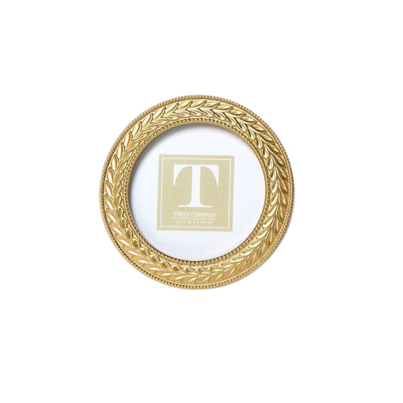 Round gold photo frame with an intricate laurel wreath design and beaded edges.
