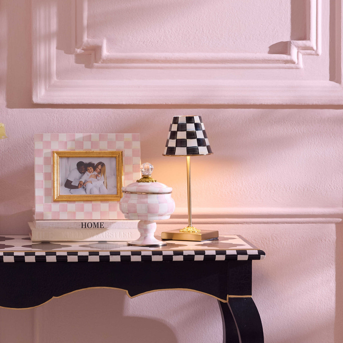Rechargeable cafe table lamp with hand-painted checkered enamel base in mild steel and three adjustable light levels.
