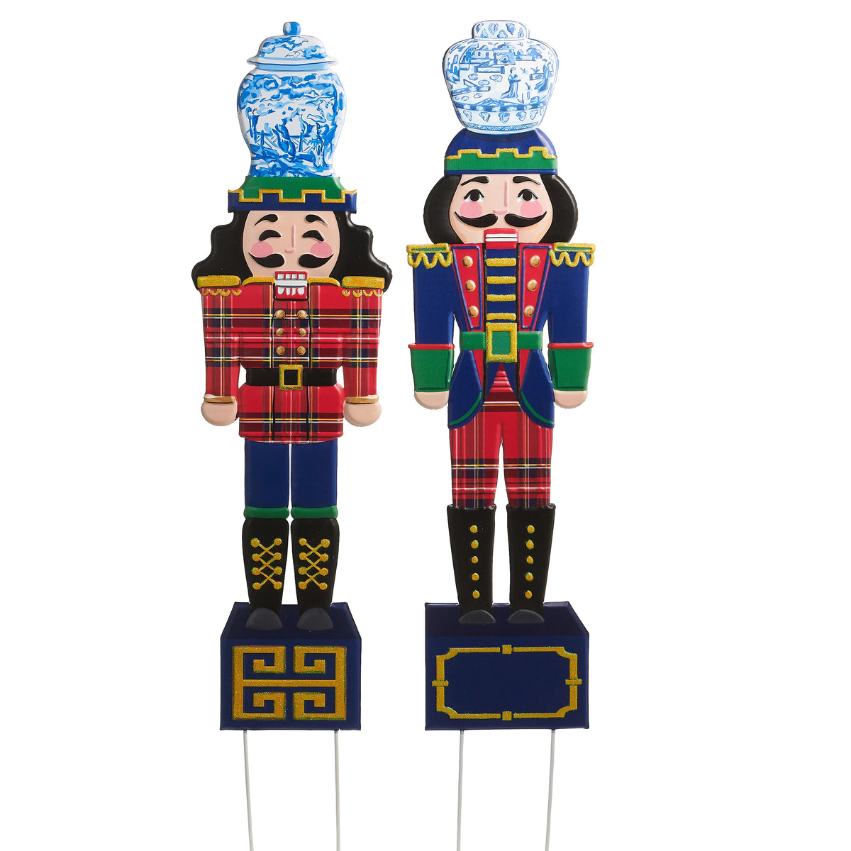 Two 44.5-inch metal nutcracker yard stakes with plaid outfits and blue and white porcelain hats.