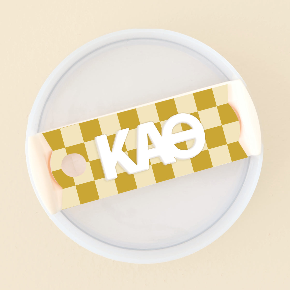 Acrylic tumbler lid tag featuring a sorority chapter name and emblem in white lettering on a clear background.