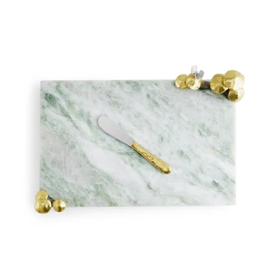 Mushroom-shaped marble cheeseboard with oxidized brass spreader