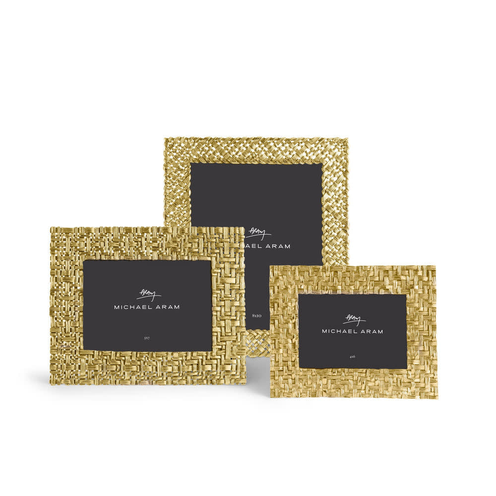 Antique goldtone palm leaf frame with sculpted texture in vertical orientation