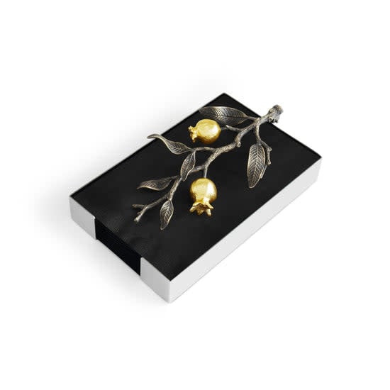Michael Aram Pomegranate napkin holder in oxidized brass with gold plate and stainless steel accents.