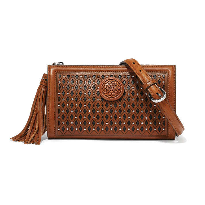 Michela cross body bag in russet leather with diamond eyelet shell.