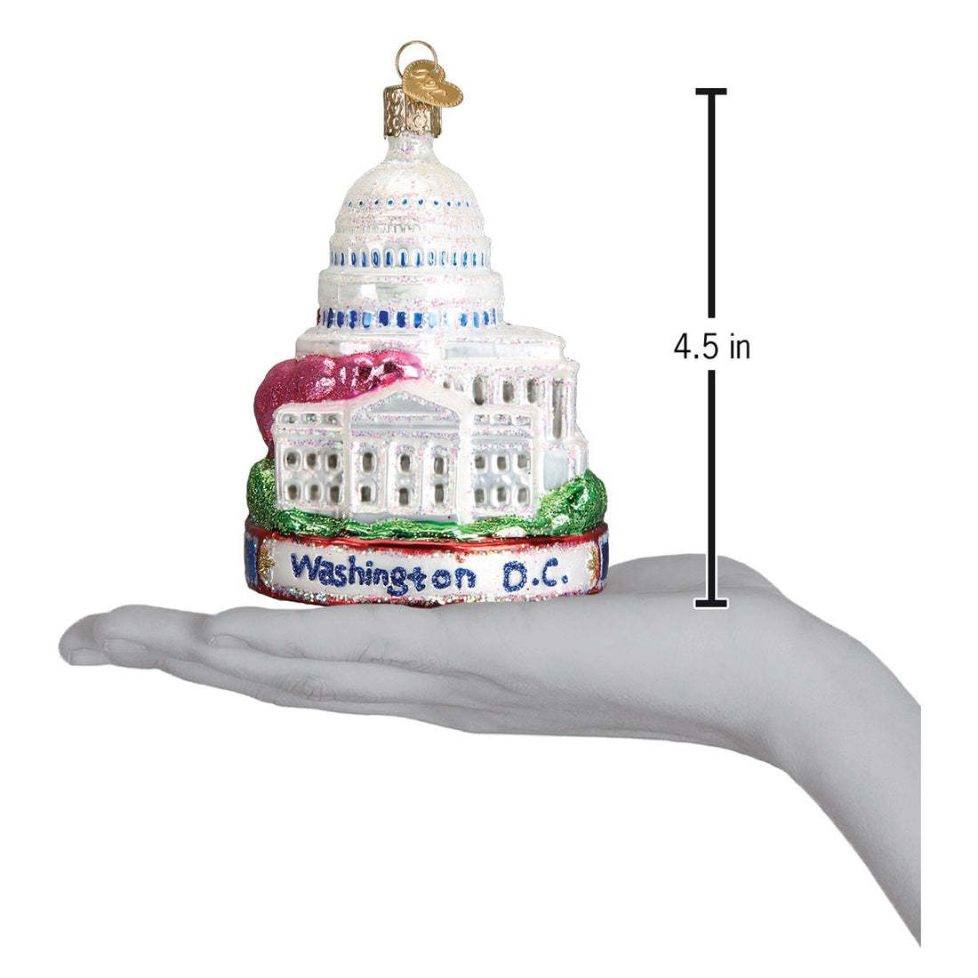 Red ceramic Christmas ornament shaped like the Washington Monument with a gold star at its peak.
