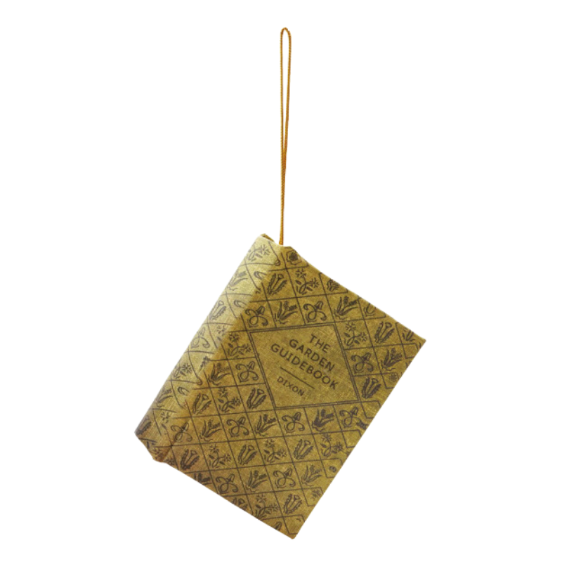 MDF and fabric book ornament titled The Garden Guidebook by Dixon with a gold hanging string.