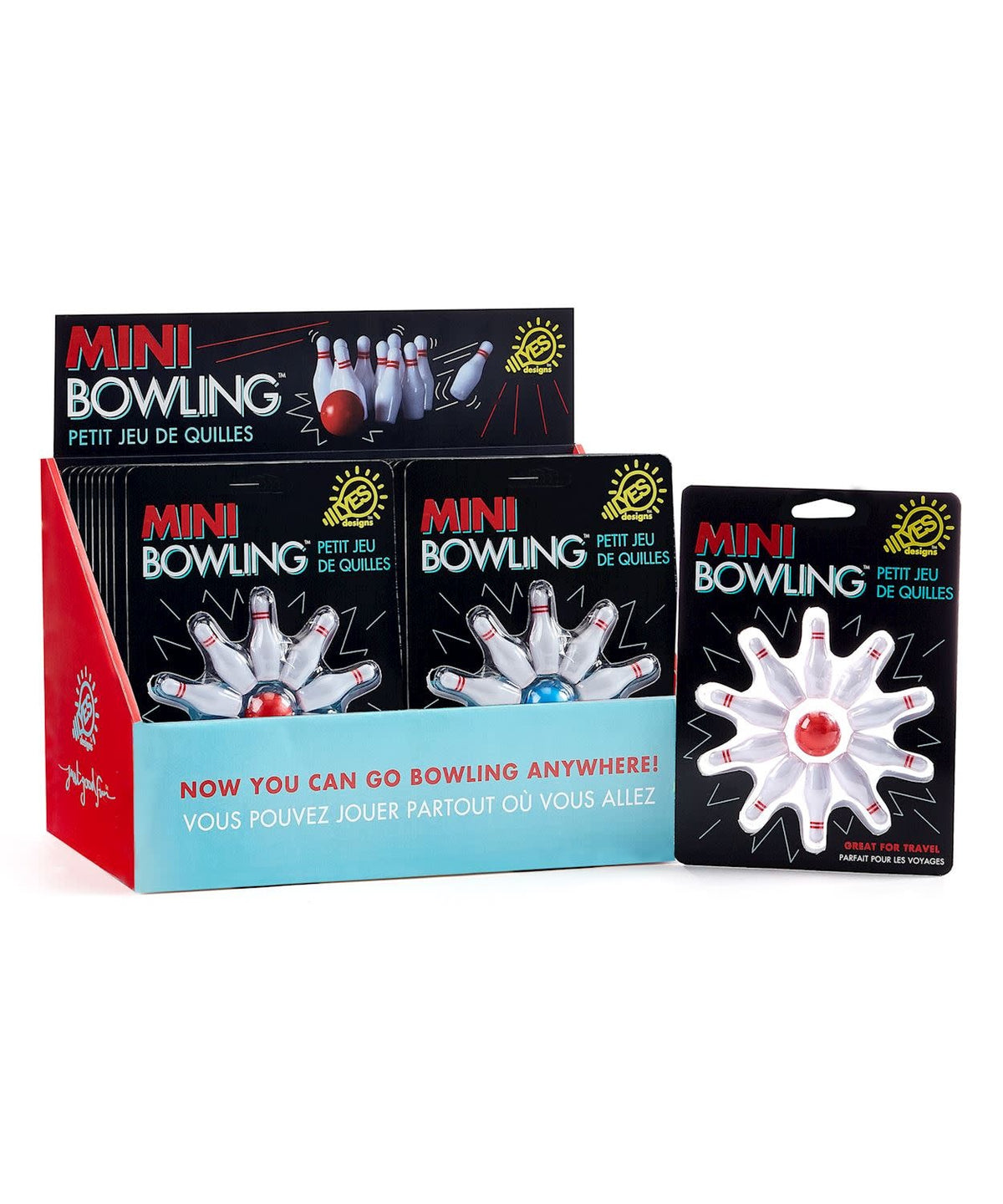 Miniature bowling set with one ball and ten pins on a tabletop surface.