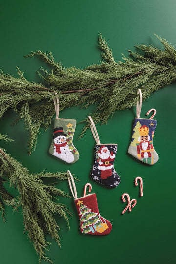 Mini needlepoint stocking in red canvas with gold trim.