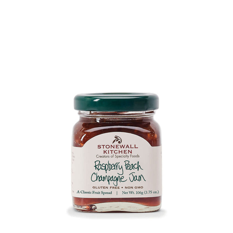 Mini jar of Raspberry Peach Champagne Jam with visible fruit pieces