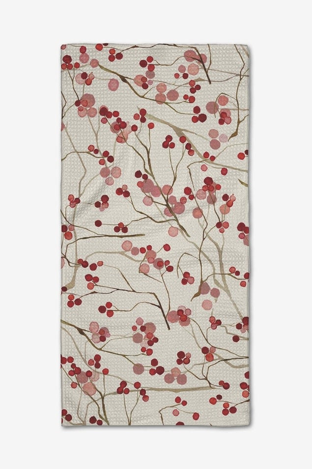 Mini kitchen towel in berry with branch print made from recycled materials.