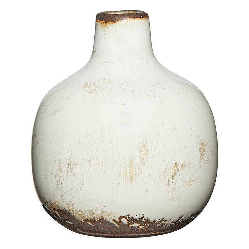 White ceramic mini vase with a simple cylindrical shape.