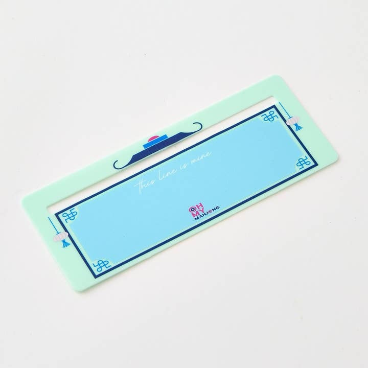 Mint green Mahjong Line Finder tool with a simple geometric shape designed to help locate lines on cards.
