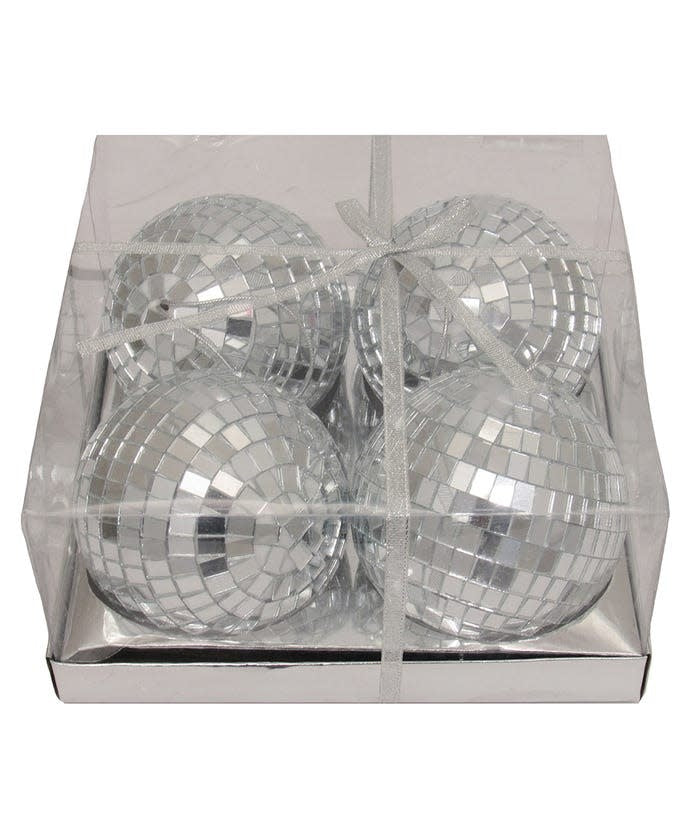 Set of four large glass disco ball ornaments with mirrored facets hanging from silver strings.