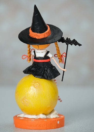 Poly resin figurine of a whimsical moon character with playful pose.