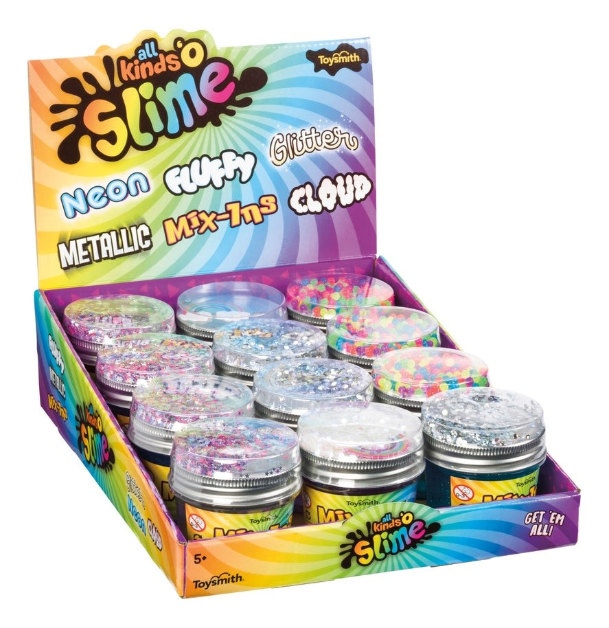 A colorful cup of slime topped with confetti mix-ins in a clear container.