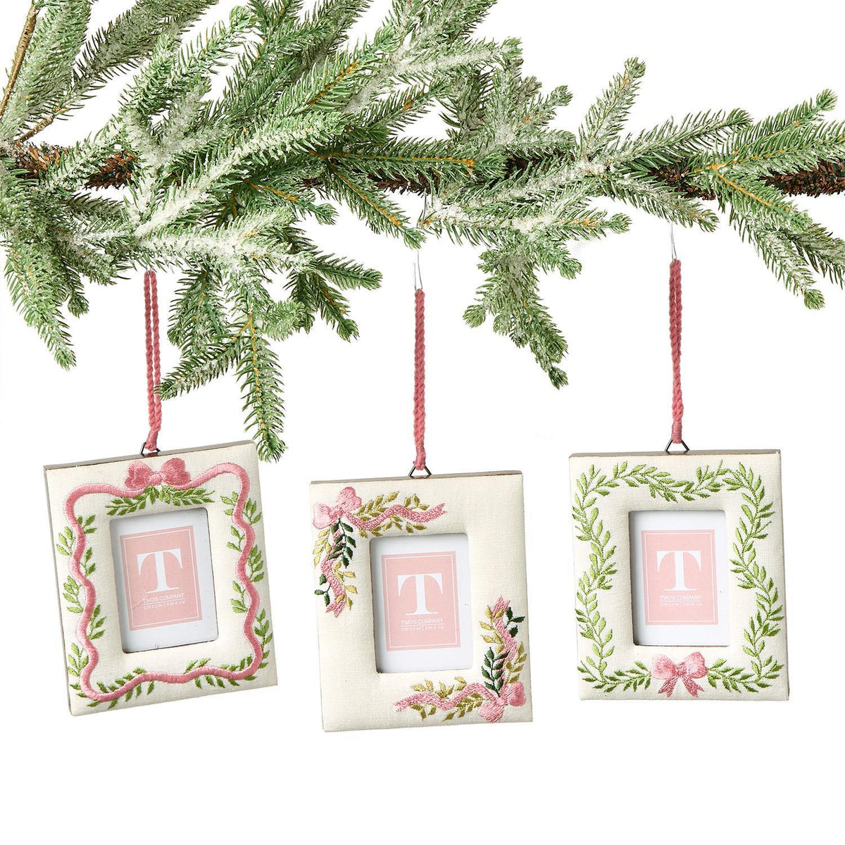 Holiday Memories embroidered photo frame ornament in red with gold thread detailing holding a small rectangular opening.