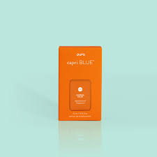 Orange box of Pumpkin Dulce Pura Refill fragrance vial by Capri Blue against a light blue background.