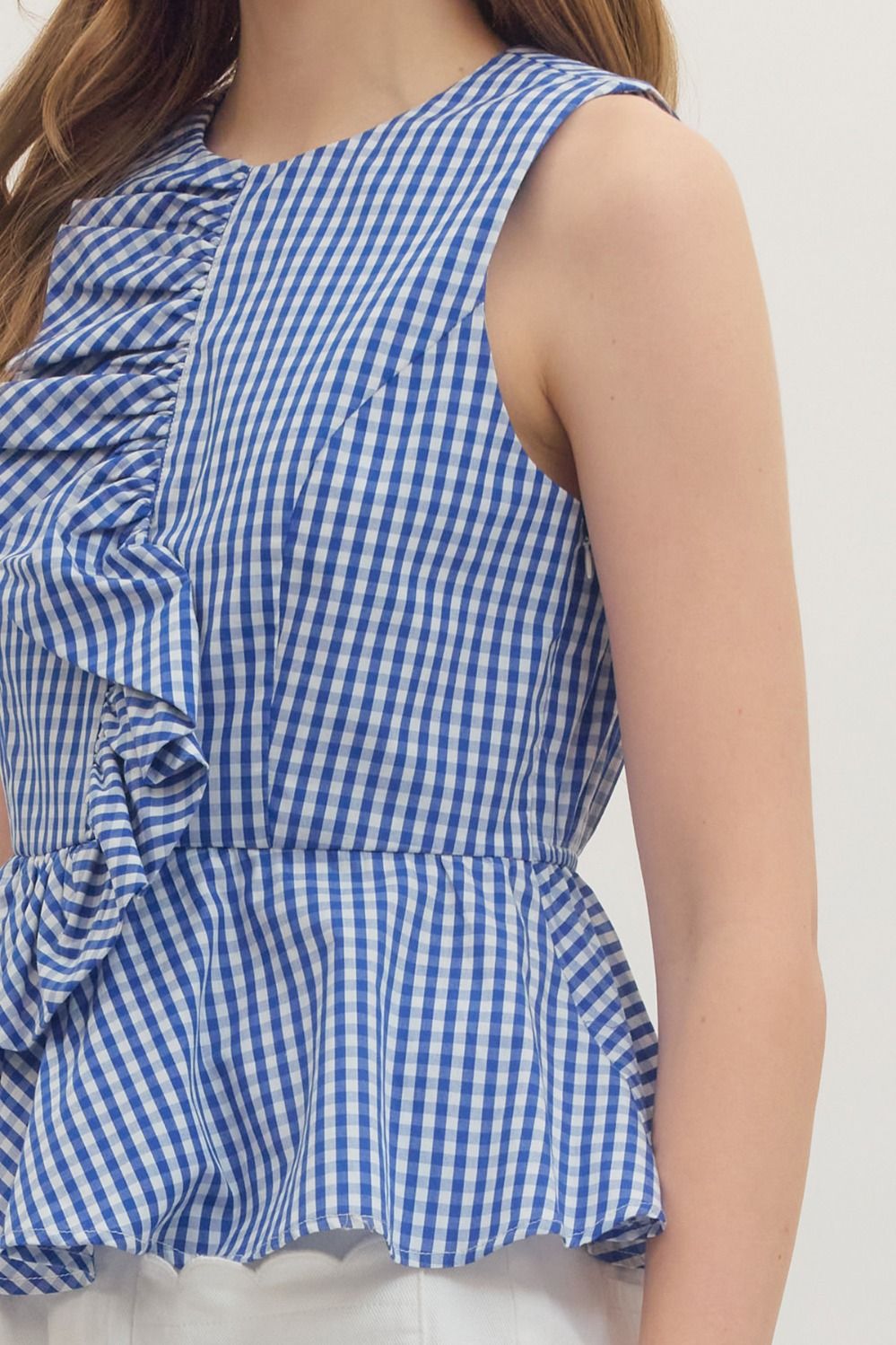 Women's Jessica gingham sleeveless peplum top with asymmetric front ruffle and elasticated back waist in white cotton.