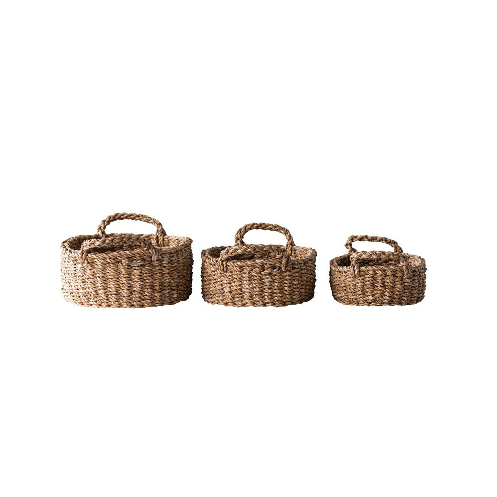 Woven seagrass basket with natural beige color and open weave pattern