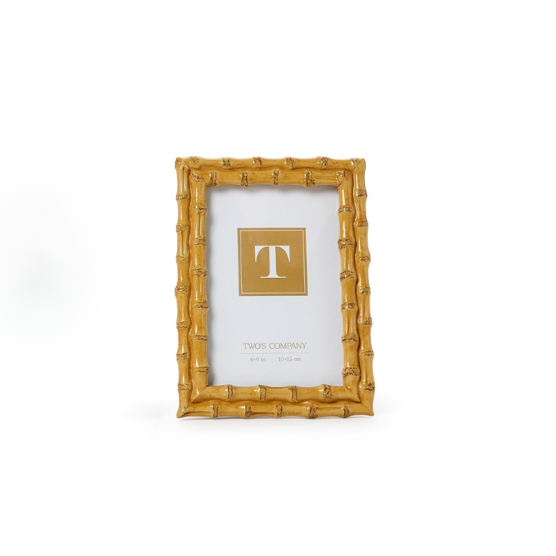 Blonde faux bamboo photo frame with a 4x6 inch opening and velvet backing.