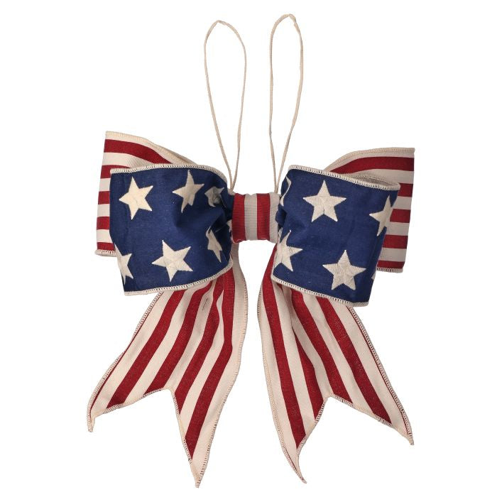 4-inch by 12-inch Americana premade bow with red white blue stripes and stars on a cream background.