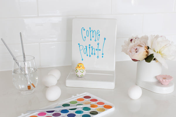 6x8.5 inch white ceramic message board with black pinstripe pattern and metal mounting hardware.