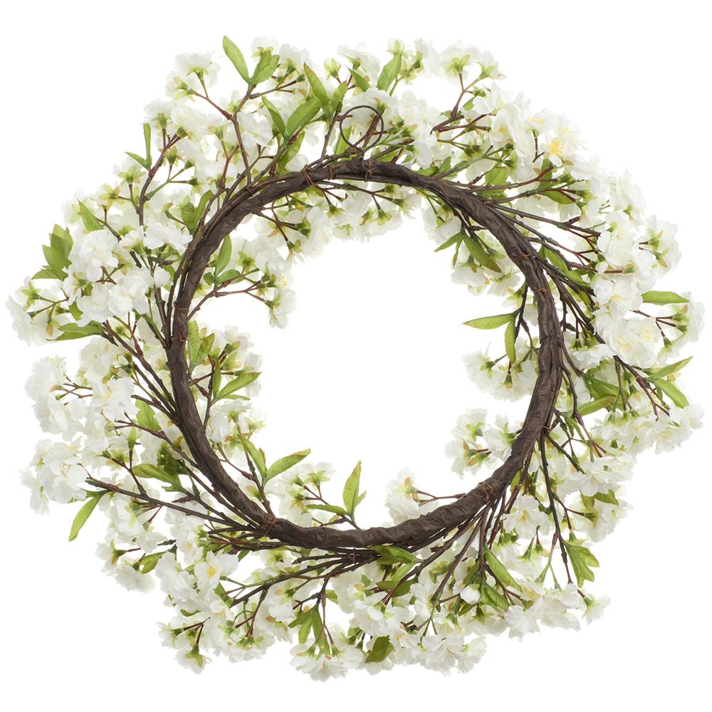 Round cherry blossom wreath with pink floral patterns on a metal wire frame.