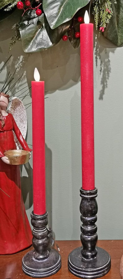Set of three unscented Moving Flame LED taper candles in warm white wax with realistic flickering flames and built-in push buttons.