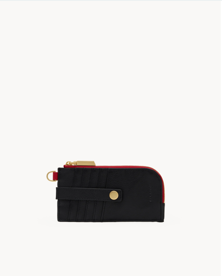 Black leather 210 East Wallet with red zipper trim, gold hardware, and multiple card slots.