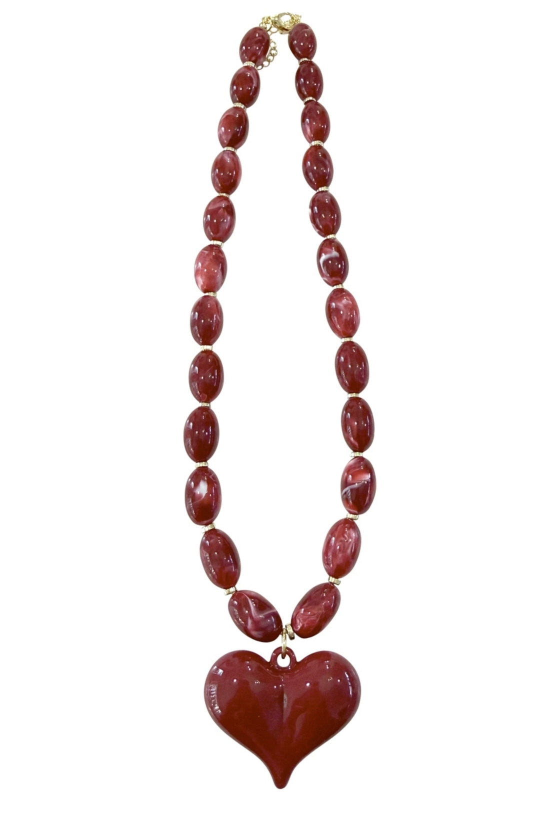 Roxie necklace featuring a bold geometric pendant on a delicate chain in metallic gold finish.
