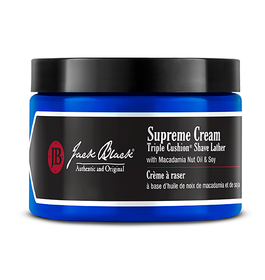 Supreme Cream Triple Cushion Shave Lather in a clear jar with white cream and macadamia nut oil.
