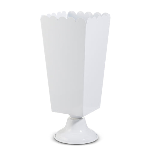 White scalloped iron urn with a square body and round pedestal base.