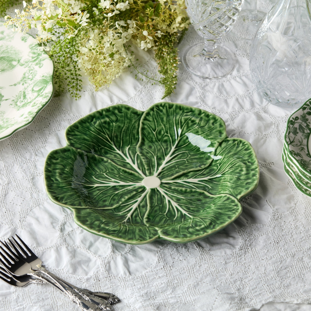 Green sculptural cabbage dinner plate with raised edges and white veining