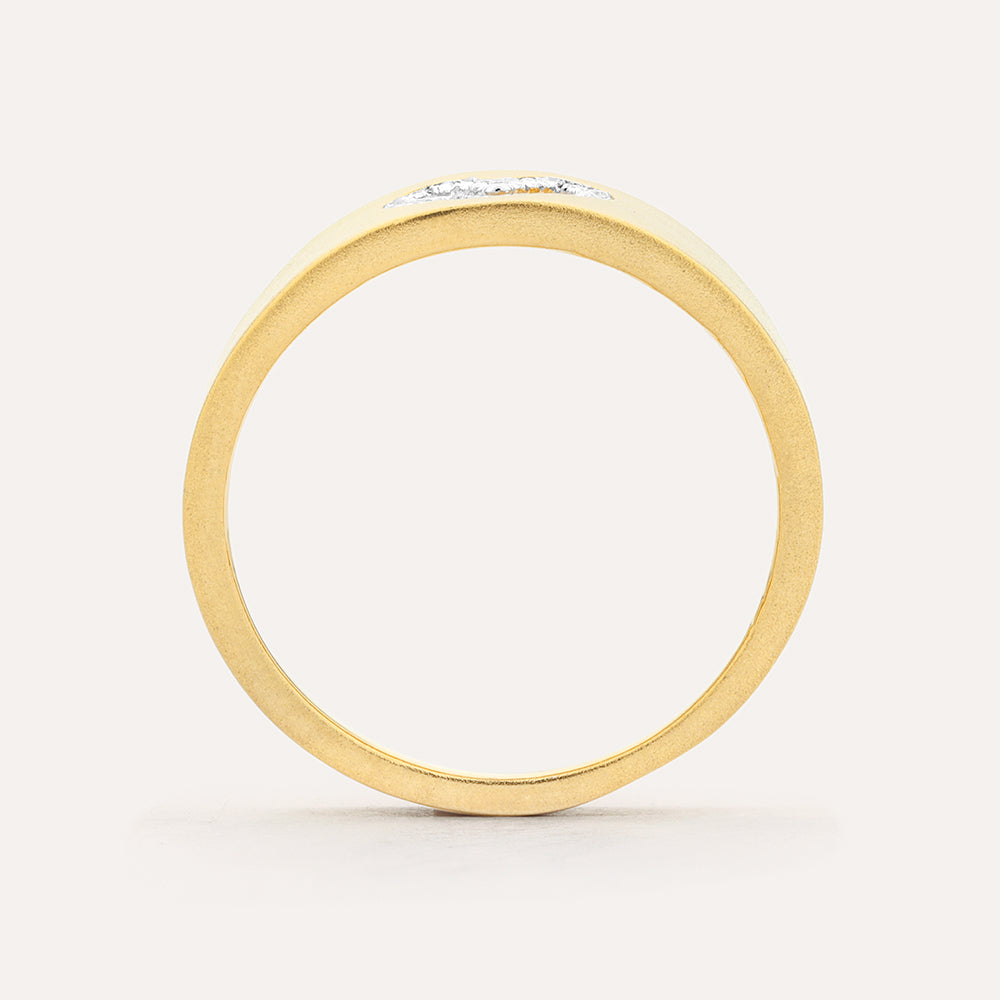 Side view of a thick 14k gold plated sterling silver statement ring with small inset diamonds.