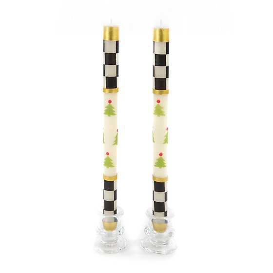 Set of two 12-inch dinner candles featuring black and white check bands and green Christmas trees.