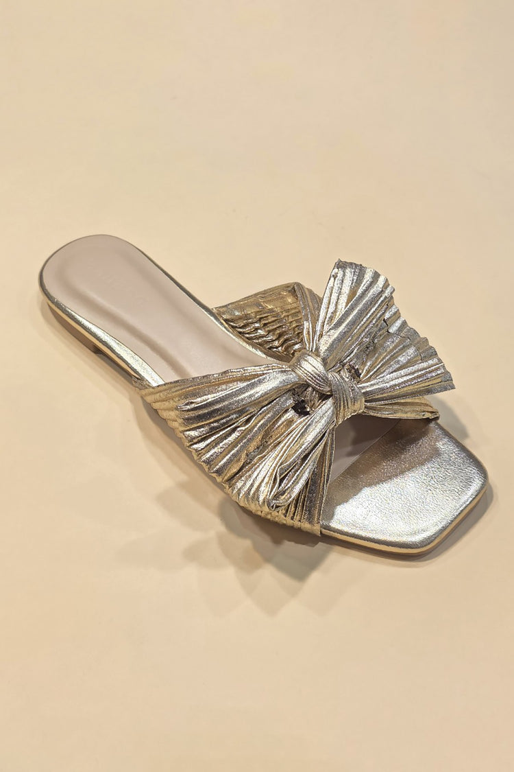 Metallic fabric ribbon slide flat sandals with a sleek strap across the toes.