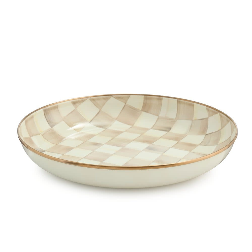 Hand-glazed steel abundant bowl with mocha checkered pattern and bronzed stainless steel rim.