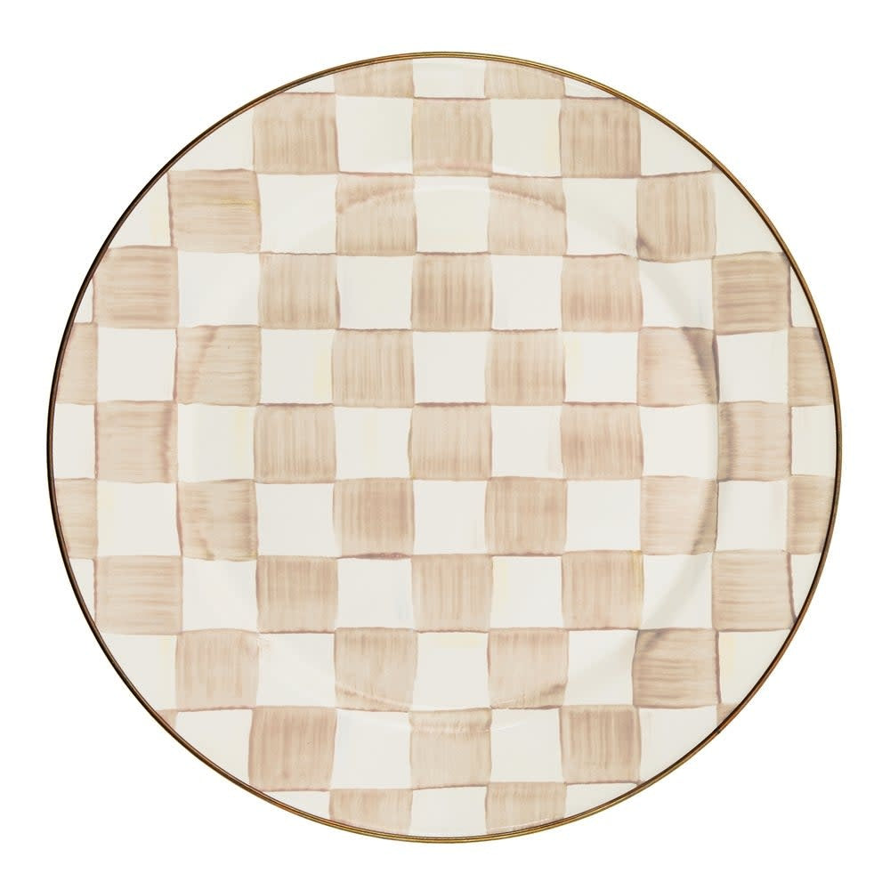 Round mocha check charger plate with hand-painted coffee-colored checks on heavy-gauge steel rimmed in bronzed stainless steel.