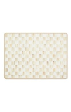 Set of four mocha checkered MDF placemats with cork backing.
