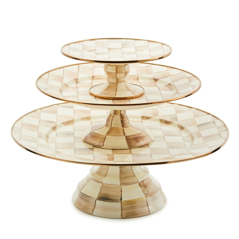 Large pedestal platter with mocha checkered steel body, bronzed stainless rim, and raised center.
