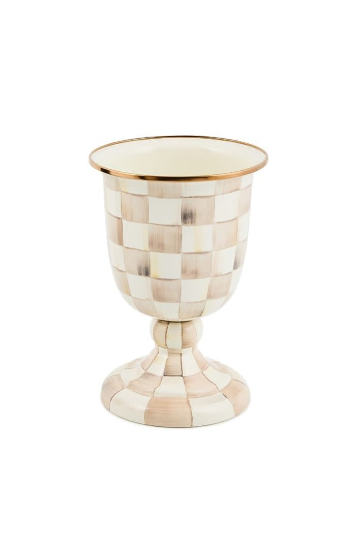 Elevated steel pedestal vase with hand-painted mocha checks on a curvy silhouette.