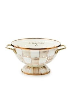 Small colander with hand-painted mocha check pattern on steel body and antiqued brass handles.