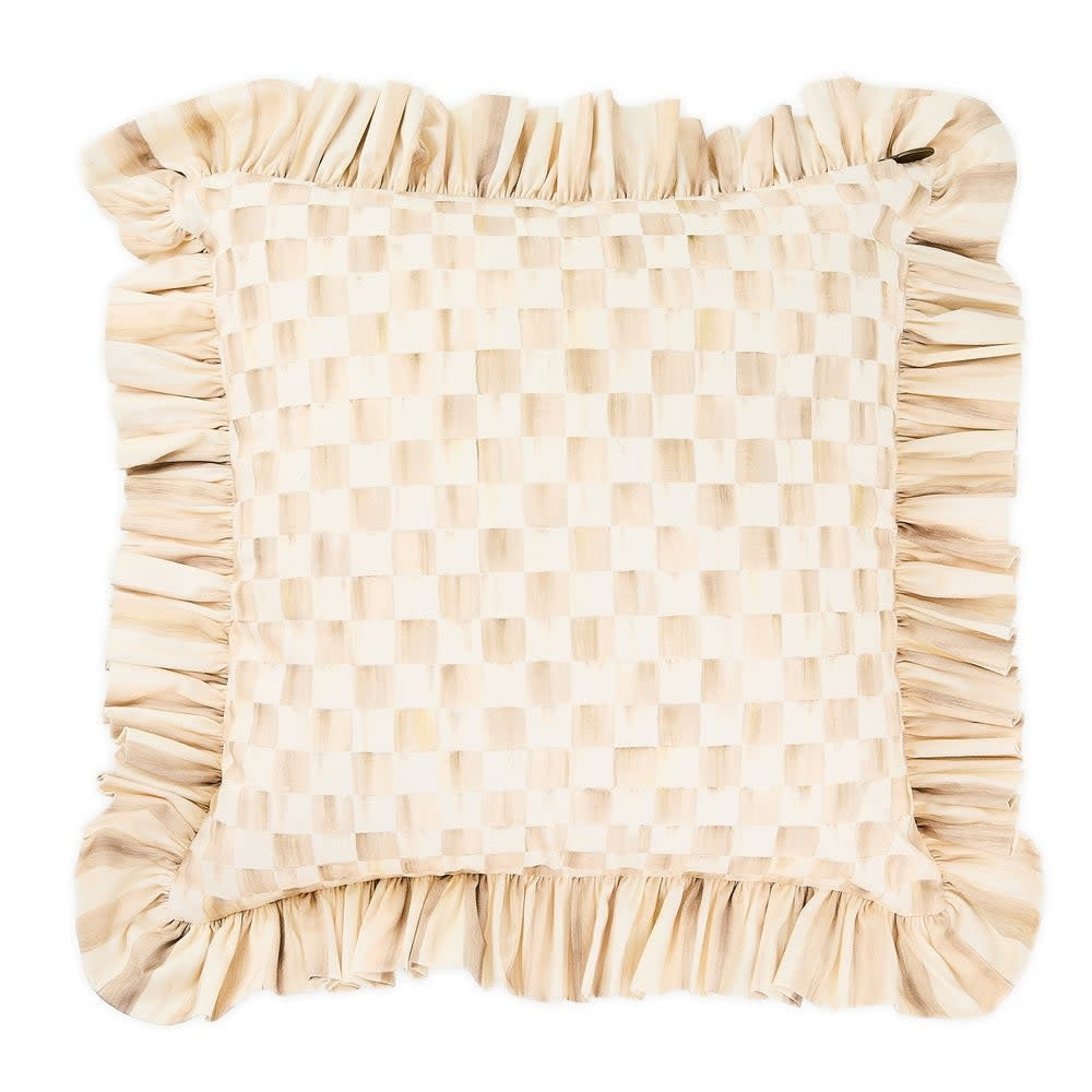 Mocha check cotton throw pillow with ruffle trim on a sofa