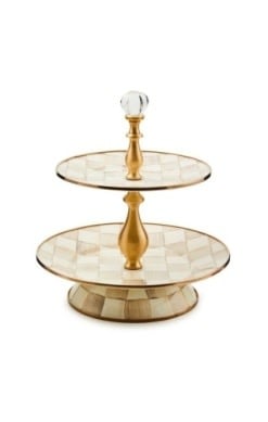 Two-tier sweet stand with hand-painted mocha check pattern on steel base topped by glass knob and brass hardware.