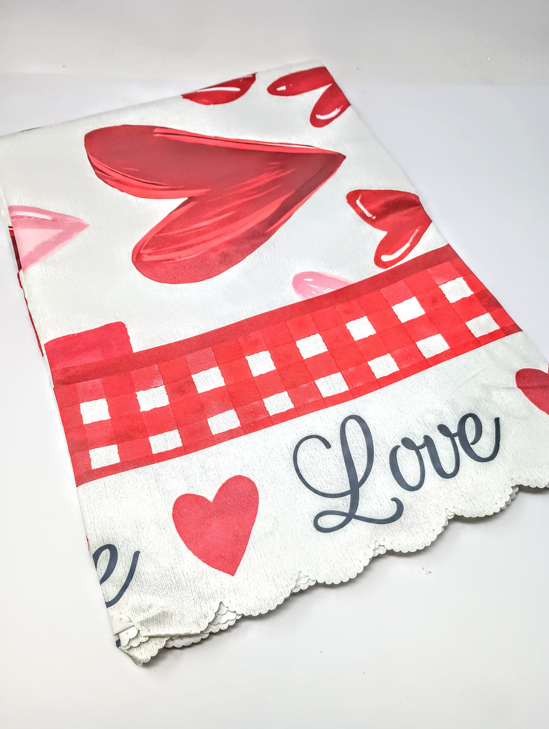 Red rectangular tablecloth with white heart patterns