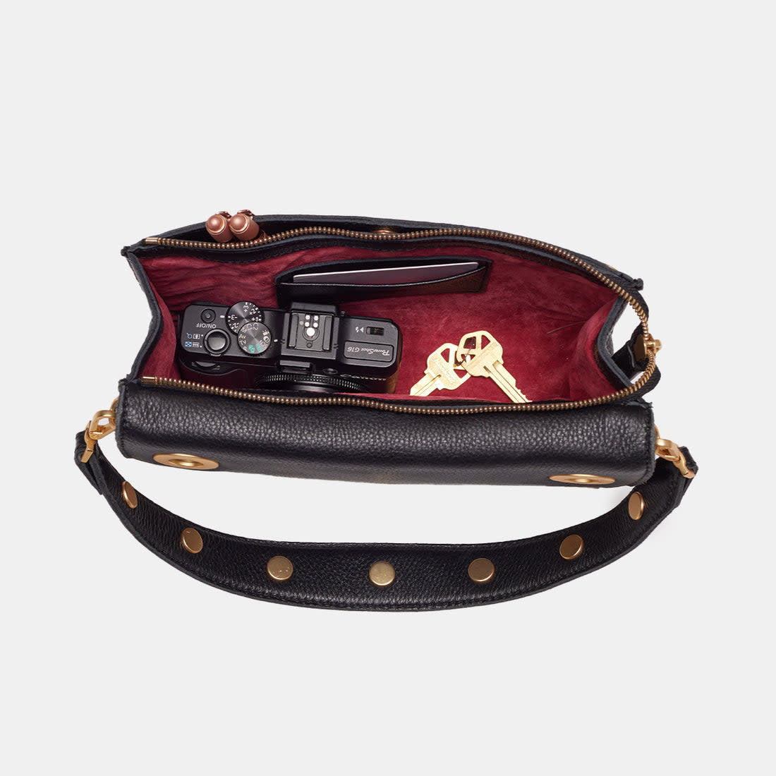 Black brushed gold Montana clutch with vintage Hammitt strap, magnetic closure, red base reveal, and detachable crossbody straps.