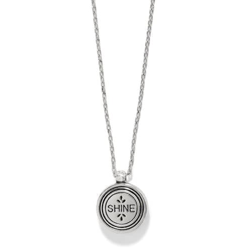 Two-tone silver and gold round pendant necklace with a crystal center.
