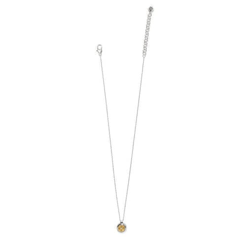 Mini round two-tone pendant necklace with silver-gold finish, brushed gold inlay, and center crystal.